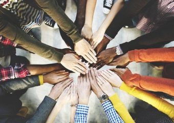 Image of many hands together